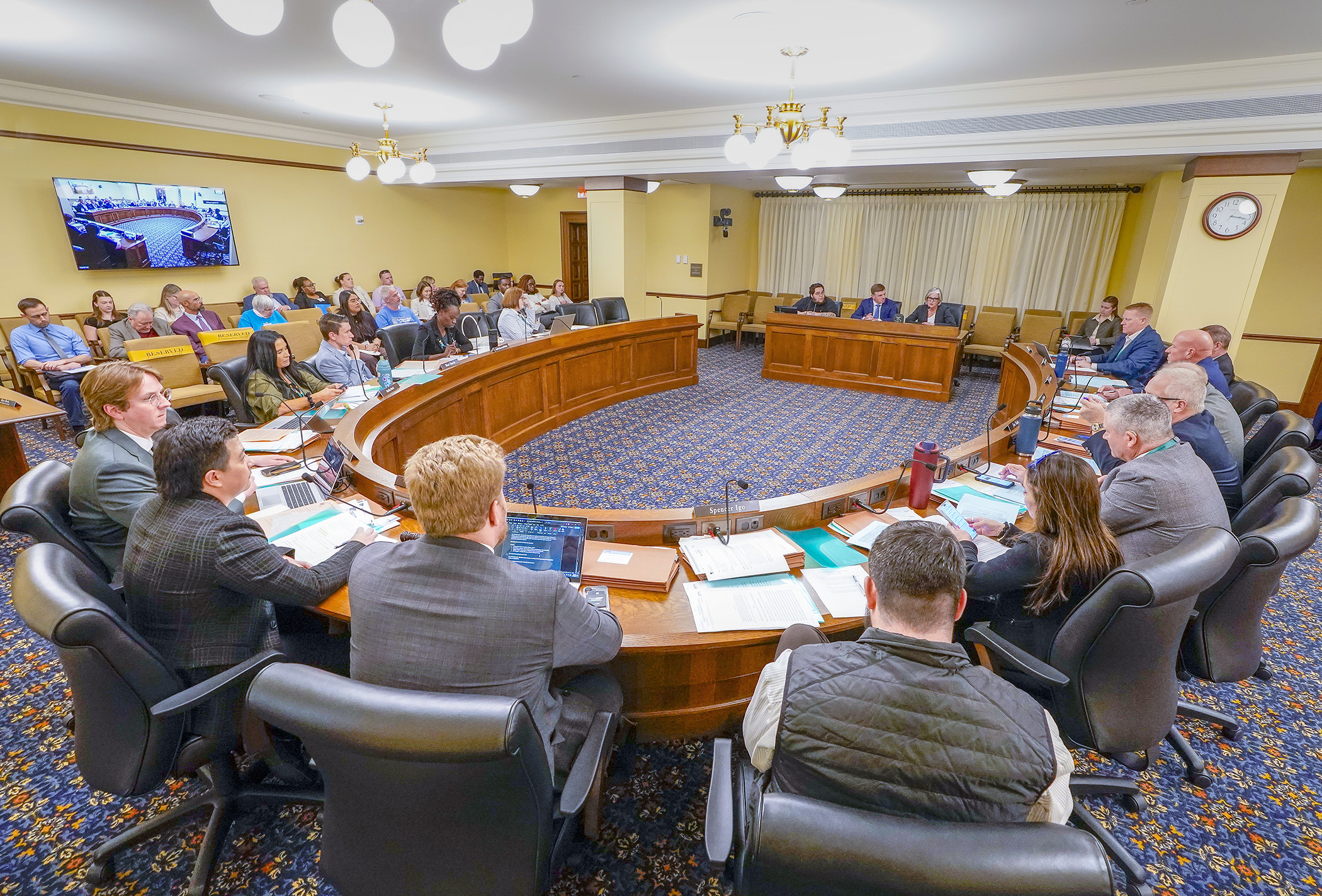 The House Housing Finance and Policy Committee listens to testimony April 8 on a bill that would propose a constitutional amendment to raise the state sales tax rate by three-eighths of 1% to fund housing initiatives. (Photo by Andrew VonBank)